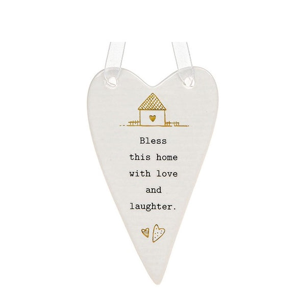 This lovely heart shaped, ceramic plaque from Thoughtful Words Ceramics brings a blessing to the home - ideal for a new home present. This white glazed heart is decorated with a tiny gold house above black stamped text that reads 