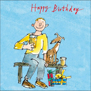 This Quentin Blake birthday card shows a young man holding up a glass of beer, with a dog at his side and presents at his feet. The caption on the front of the card reads "Happy Birthday".