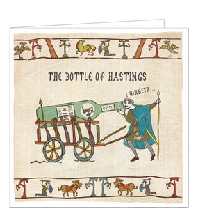 This funny blank card is from the Hysterical Heritage greetings card range by Ian Blake. A Bayeux Tapestry-style illustration shows man drinking from a giant bottle of wine on a wagon. The caption on the front of the card reads "Bottle of Hastings".