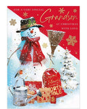 Celebrate the holiday season with our cheerful Christmas card for a beloved grandson. The festive red, gold, and white design features a jolly snowman on a snowy slope, along with adorable touches of a robin on a watering can and festive presents. Share the joy and love with your grand-son this Christmas.
The caption on the front of this Christmas card reads "For a very Special Grandson at Christmas with love".