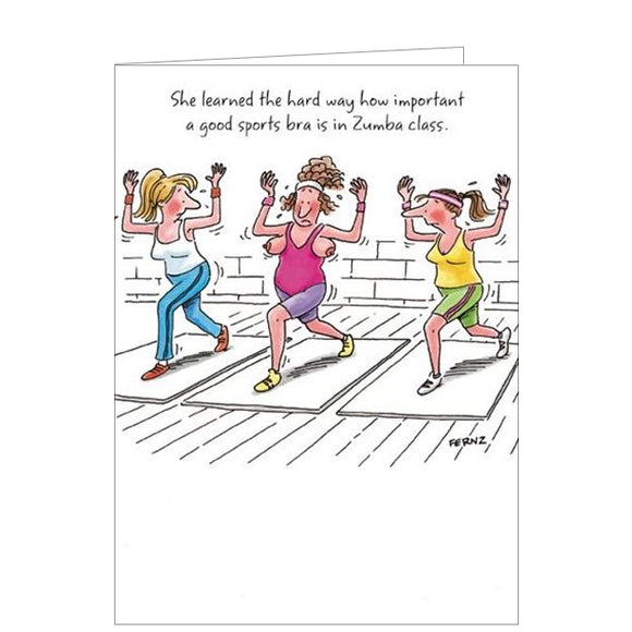 This cheeky, adult greetings card shows a cartoon by FERNZ showing three women in exercise clothing, dancing on exercise mats. The woman in the middle is embarrassed because her breasts have slipped out of her shirt. The caption on the card reads 