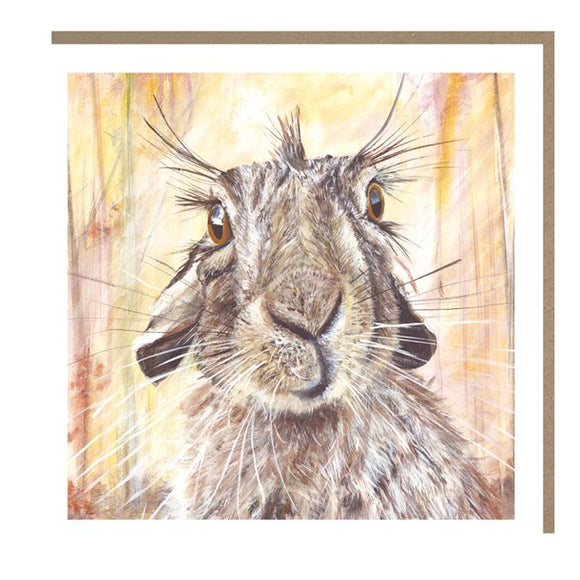 This lovely blank greetings card features detail from an artwork by Julia Pankhurst showing a wild brown rabbit with a comical tuft of hair  looking straight out of the picture.