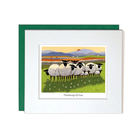 This cute little thinking of you card by iconic artist Thomas Joseph is decorated with a flock of sheep and lambs, all looking out of the image towards the viewer, as the sun sets behind mountains in the background. The caption on the front of the card reads 