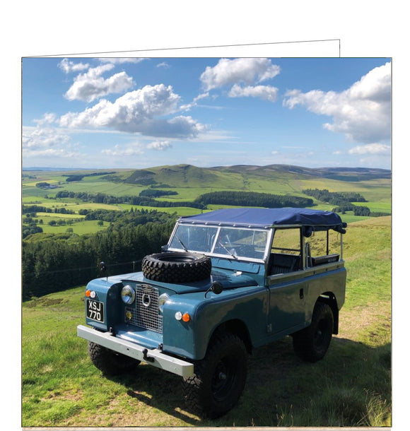 This greetings card from the BBC Countryfile card range features a photograph of a vintage 1961 series 2a blue land rover parked with the beautiful scenery of Whitehill, South Lanarkshire in the background. 