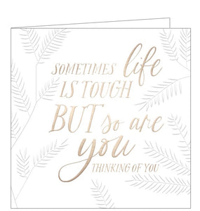 A beautiful, simple card by Clare Maddicott to show the recipient that you are thinking of them at a difficult time and sending special encouragement. Silver text on the front of the card reads "Sometimes life is tough BUT so are you...thinking of you".