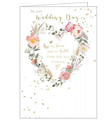 This lovely wedding day card is decorated with a heart-shaped wreath of pink and white flowers. Golden confetti flutters across the card, while text in the centre of the wreath reads 