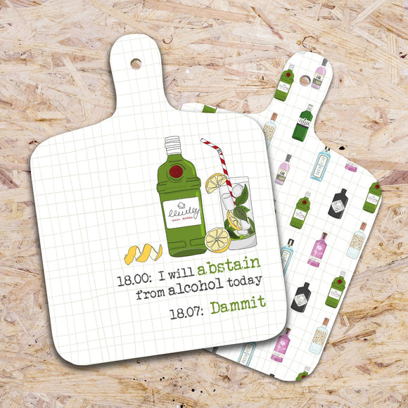 This small chopping board from Dandelion Stationery is decorated with a glass, filled with ice, mint and lemon slices, standing next to a bottle of gin. The text on the front of the choppingboard reads 