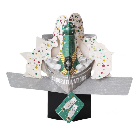 Pop-up 3D congratulations card shaped like a bottle of champagne overflowing with colourful confetti. The text on the front of this card reads 