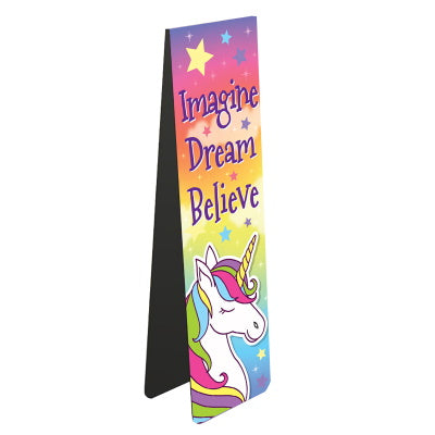 This magnetic book mark is ideal for young readers - or the young at heart. A unicorn with a colourful mane stands against a rainbow-sky. Text on the bookmark reads 