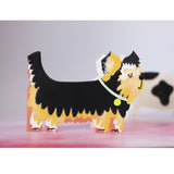 This adorable and unusual blank greetings card is cut into the shape of a lovely Yorkshire Terrier dog, complete with a shaggy coat and smart collar. This card is blank inside so can be used for any occasion.