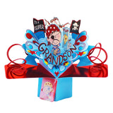 This wonderful pop-up birthday card for a very special Grandson opens to reveal a young boy in an eye patch, polkadot bandana and fake moustache surrounded by blue and glittery red streamers. The boy holds a treasure map and a pirate ship can be seen on the sea behind him. Text on the card reads "To a Super Grandson". The card comes with an attached tag and space on the back of the card to add your own messages.