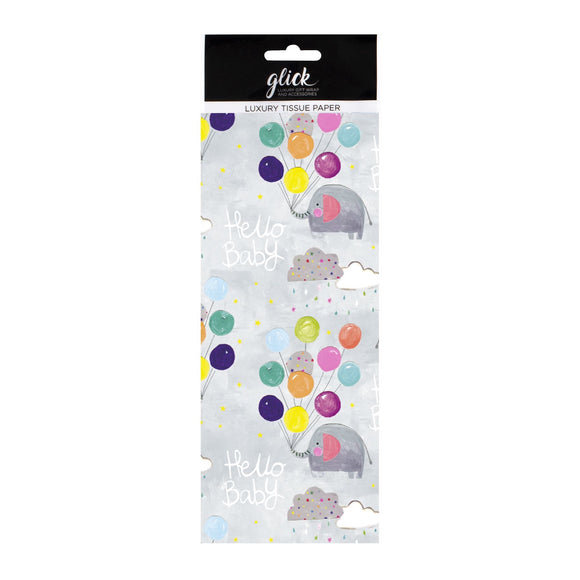 This patterned tissue paper is perfect for wrapping gifts, cushioning delicate items and or adding a cute touch to new baby gift bags. This tissue is decorated with a repeating pattern of cute elephants holding bunches of colourful balloons in their trunks, floating through the sky. White text on the paper reads 
