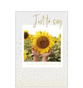 Perfect for&nbsp;many occasions - just to keep in touch, get well, or thinking of you this cheerful card shows a sunflower with a heart shape in the middle. Gold text reads “Just to say".
