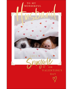 It doesn't come sweeter than this--two canine noses snuggled under a heart-scattered duvet. Gold text on the front of this Valentine's card reads "To my Wonderful Husband...Let's snuggle on Valentine's Day".