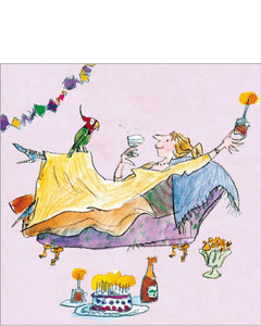 This birthday card is decorated with a woman reclining on a chaise with a glass of wine and a birthday cupcake. A parrot rests on her knee.