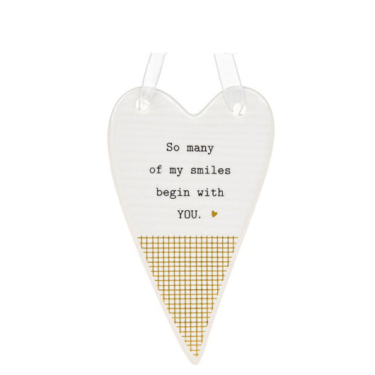 This ceramic plaque from Thoughtful Words Ceramics is an ideal gift to remind a romantic partner or a cherished family member know you're thinking of them. The white glazed heart is decorated with black text that reads 