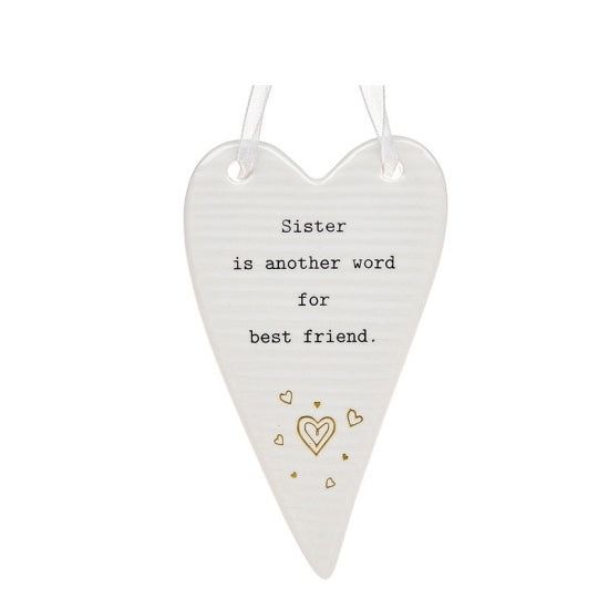 This ceramic plaque from Thoughtful Words Ceramics is an ideal way to express your love and appreciation for your sister. The white glazed heart is decorated with tiny gold hearts beneath stamped black text that reads 