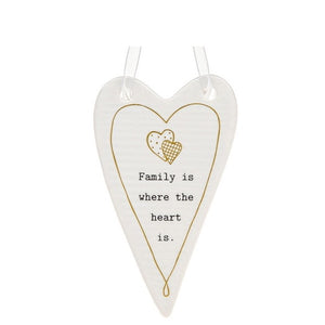 This lovely heart shaped, ceramic plaque from Thoughtful Words Ceramics is the perfect gift to remind your loved ones of the power of family. This white glazed heart is decorated with two overlapping hearts and inscribed with the phrase "Family is where the heart is" in black lettering.