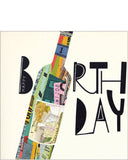 A large, patchwork wine bottle covers the front of this birthday card. Black text around the bottle reads "Happy Birthday".