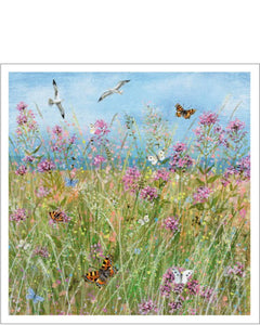 This beautiful blank card features the artwork of Lucy Grossmith showing a meadow bursting with flowers, butterflies and gulls. The colouring is&nbsp; a superb mixture of blues, pinks, and greens.