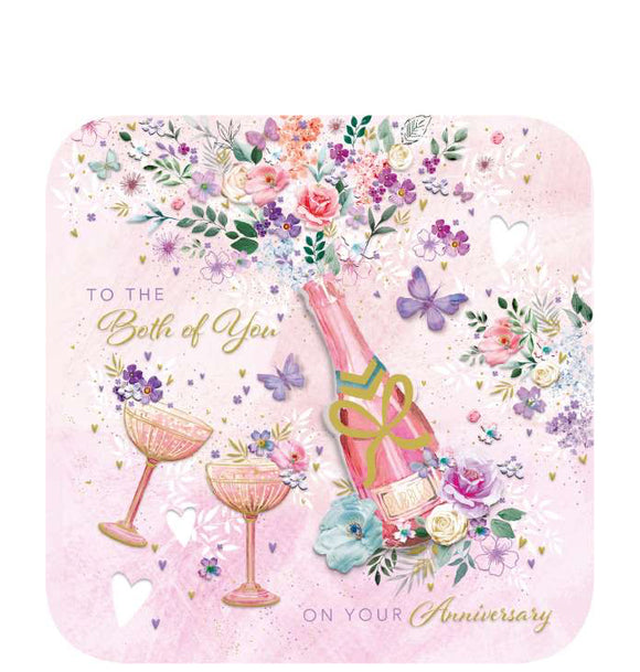 Send your special friends a heartfelt message with this lovely anniversary card. This beautiful anniversary card is decorated with a decoupage'd bottle of champagne alongside two glasses, and floral bouquets on a pink background. The caption on the front of the card reads 
