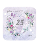 Celebrate special friends' silver wedding anniversary with this stunningly gorgeous card! Featuring decoupage silver '25' in a heart outline, and surrounded by vivid floral bouquets and butterflies on a lilac background, this card is the perfect way to celebrate this momentous occasion. 