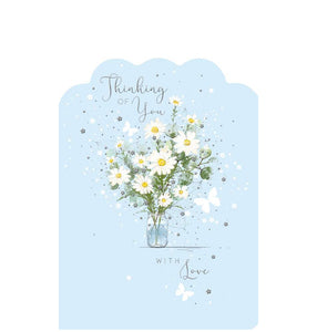 This beautiful thinking of you card is decorated with an illustration by Franny Lee of small white butterflies fluttering around a vase of white flowers. Silver text on the front of the card reads "Thinking of you..with love".