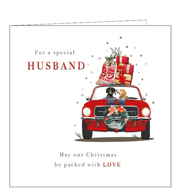 This cute christmas card for a special husband is decorated with a red car, with a wreath on the front, presents on the roof - and a pair of dogs sitting in the front seats! The caption on the front of the card reads 