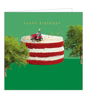 This unusual birthday card is decorated with a scene of a man, in a party hat, driving a lawnmower over the top of a giant birthday cake - and scattering sprinkles behind him. Gold text on the front of the card reads "Happy Birthday".