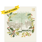 This pack of charity Christmas cards includes 5 cards of one design. The front of the cards is decorated with an illustration by Emily Needham showing three sheep in a snowy field. The scene is wreathed by sprigs of holly, while the caption on the front of the cards reads "Magical"