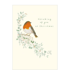 This card is perfect for letting a loved one know they are in your thoughts at a busy time of year. Featuring a charming illustration of a robin on a branch, the front of the card reads "thinking of you at Christmas".