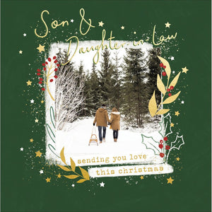 This christmas card for a special couple is decorated with a photograph of a couple talking hand-in-hand towards a snowy forest. The caption on the front of the card reads "Son &amp; Daughter-in-Law...sending you love this christmas".