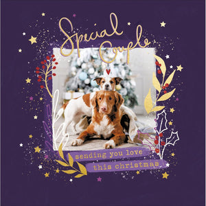 This cute Christmas card for a special couple is decorated with a photograph of a pair of dogs cuddling together in front of a Christmas tree. The caption on the front of this Christmas card reads "Special Couple...sending you love this Christmas".