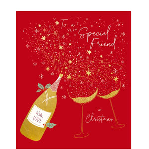 This festive Christmas card features a bottle of&nbsp;of Christmas tipple and two glasses fizzing with golden bubbles and stars. The caption on the front of this card reads "To a very Special Friend at Christmas".