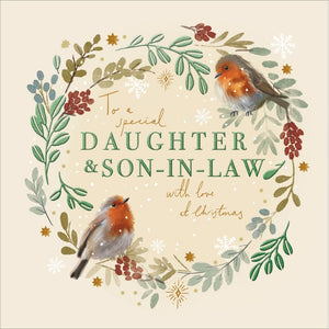 This stunning Christmas card for a special daughter and son in law is decorated with a wreath of festive foliage surrounding script that reads "To a special Daughter &amp; Son-in-Law with love at Christmas". A pair of very realistic robins are perched on the wreath.