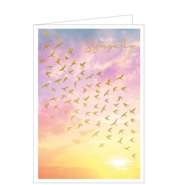 A beautiful sympathy card showing a flock of golden birds flying across a colourful sketched sunset. The sky ranges from blue at the top of the card, through pink, to yellow at the bottom.