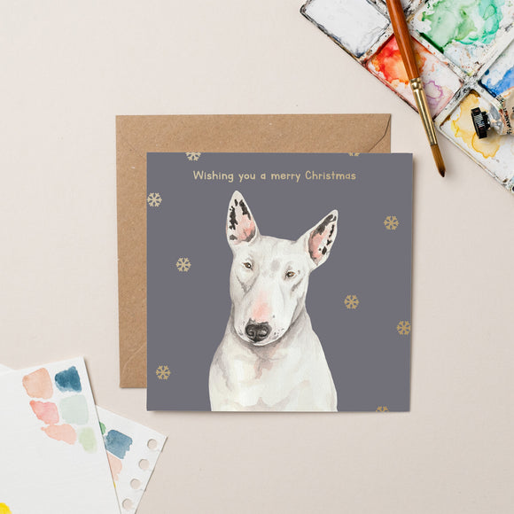 This festive charity Christmas card features Daisy, an English bull terrier who lives on the street with her houseless owner, and has been treated by Street Vet multiple times. The beautiful dusky-blue background and golden snowflakes serve as a backdrop for Daisy, pictured on the front with the caption, 