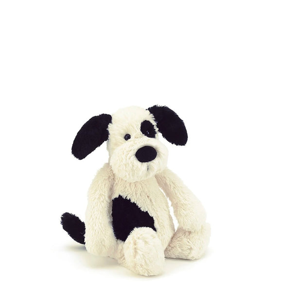 Silky-soft and lovingly loyal, Jellycats' bashful black and cream puppy dog from Jellycat wants to play all day! His smudgy black patch and sooty tail make him even more adorable!