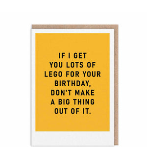 A smaller birthday card featuring black metallic text against a mustard coloured background. The text on the front of the card reads "If I get you lots of Lego for your birthday, don't make a big thing out of it".