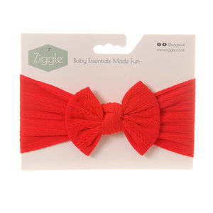 Finish off little outfits with this gorgeous festive red headband from Ziggle. It's perfect for little fashionistas and even fits Mummas, allowing you to match with your little one. With its stretchy, comfortable material, this headband is easy to slip on and won't irritate your baby's delicate skin. Create a perfect bow every time and add a touch of elegance to any look with this unique headband.