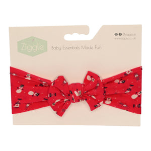 Finish off little Christmas day outfits with this gorgeous festive red headband with an all over snowman print from Ziggle.

It's perfect for little fashionistas and even fits Mummas, allowing you to match with your little one. With its stretchy, comfortable material, this headband is easy to slip on and won't irritate your baby's delicate skin. Create a perfect bow every time and add a touch of elegance to any look with this unique headband.