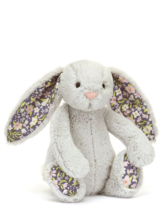 Welcome blossom silver bunny to the Jelly cat garden! Blossom Silver Bunny loves to go for a midnight stroll among the flowerbeds.  Her signature silver-grey Bashful fur is complemented by a cream bobtail, while her soft cotton floral ears and feet sport an original pink and white Jellycat design. The perfect nighttime companion for all ages.