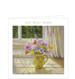 A petite get well soon card is just right for a quick note to wish someone well. This card is decorated with artwork showing a yellow jug filled with brightly coloured flowers, standing in front of a window. Gold text on the front of the card reads "Get Well Soon". 