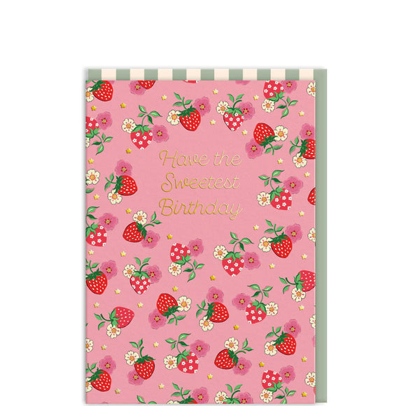 This charming birthday card designed by Cath Kidston is decorated with strawberries and mini gold stars. The front features elegant gold text that reads 