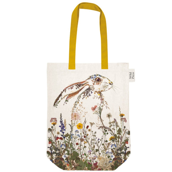 This beautiful 100% organic cotton tote bag is decorated, front and back, with Helen Ahpornsiri's illustration of a wild hare composed of wildflowers. The bag has contrasting yellow fabric straps and a matching internal pocket.