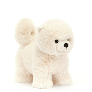 Daphne the Pomeranian dog from Jellycat is an off-white colour with very soft fur, a long, curled tail and tiny little ears