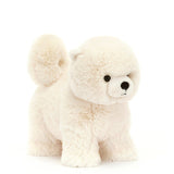 Daphne the Pomeranian dog from Jellycat is an off-white colour with very soft fur, a long, curled tail and tiny little ears