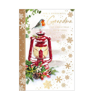 This traditional Christmas card for a special grandma is decorated with a scene of a robin perched on a red hurricane lamp, surrounded by foliage and golden snowflakes. The caption on the front of the card reads "For a wonderful Grandma, at Christmas with love".