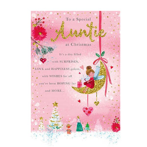 This lovely Christmas card for a special auntie is decorated with a pink and gold toned scene of a fairy sitting on a crescent-moon, high above a snowy field of Christmas trees. The text on the front of the card reads "To a Special Auntie at Christmas...It's a day filled with surprises, love and happiness galore, with wishes for all you've been hoping for, and more..."