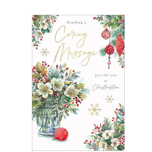 Perfect for letting someone special know they are in your thoughts at a busy time of year, this Christmas card is decorated with an arrangement of festive flowers on a crystal vase. The caption on the front of this Christmas card reads 